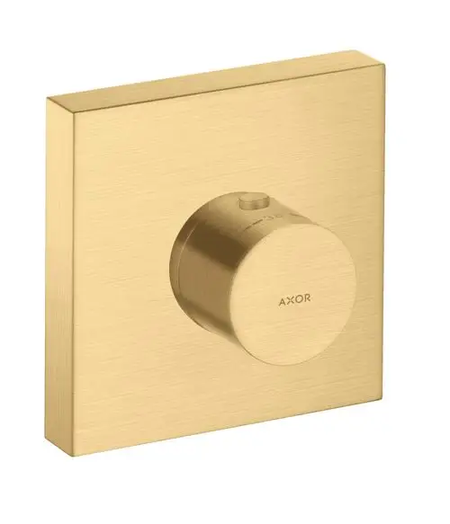 Thermostatmodul mit runder Drehknopfsteuerung auf quadratischem, gebürstetem Gold-Hintergrund. Markierung für Temperatur. Produkt der Marke AXOR.